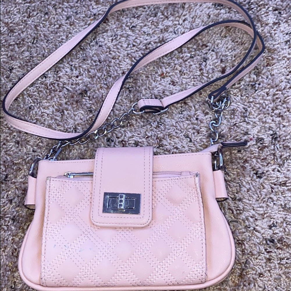 Light pink crossbody purse.
